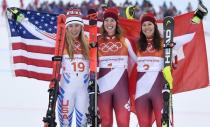 Alpine Skiing - Pyeongchang 2018 Winter Olympics - Women's Alpine Combined - Jeongseon Alpine Centre - Pyeongchang, South Korea - February 22, 2018 - Silver medallist Mikaela Shiffrin of the U.S., gold medallist Michelle Gisin of Switzerland and bronze medallist Wendy Holdener of Switzerland celebrate during the victory ceremony. REUTERS/Toby Melville