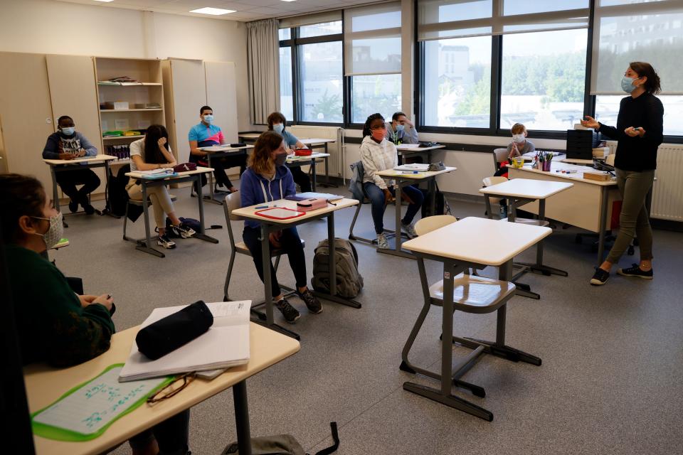 Middle school pupils attend a lesson in their classroom, on June 22, 2020 in Boulogne-Billancourt, outside Paris, as primary and middle schools reopen in France. - After six weeks of unsteady school sessions and more than three months of class at home to fight against the spread of the new coronavirus Covid-19, French pupils and middle school students return to class on June 22, thanks to a lighter health protocol. (Photo by Thomas SAMSON / AFP) (Photo by THOMAS SAMSON/AFP via Getty Images)