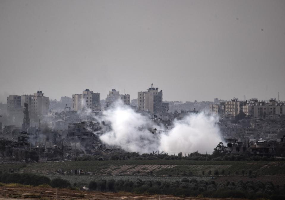 SDEROT, ISRAEL - OCTOBER 29: Smoke rises after Israeli attacks as tanks of Israeli forces are deployed on agricultural lands near the town of Beit Hanoun in the north of Gaza Strip in Sderot, Israel on October 29, 2023. Israel's attacks on Gaza, where approximately 2.3 million Palestinians live, continue on its 23rd day. (Photo by Mostafa Alkharouf/Anadolu via Getty Images)