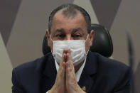 Senator Omar Aziz attends a session by the commission investigating the government's management of the COVID-19 pandemic at the Federal Senate in Brasilia, Brazil, Tuesday, Oct. 26, 2021. (AP Photo/Eraldo Peres)