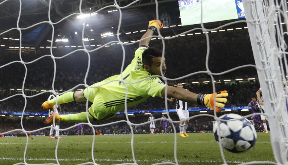 <p>CARDIFF, WALES – JUNE 03: Gianluigi Buffon of Juventus dives but fails to stop Casemiro of Real Madrid (not pictured) shot from going in for Real Madrid second goal during the UEFA Champions League Final between Juventus and Real Madrid at National Stadium of Wales on June 3, 2017 in Cardiff, Wales </p>