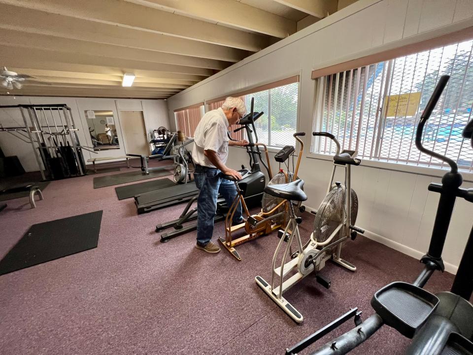 Bill Williams points out an old Schwinn exercise bike he bought for $10, repaired and added to the equipment at the Beaches Aquatic Center in Atlantic Beach. The facility is celebrating its 60th year with an old-timers swim meet on Saturday, Oct. 7.