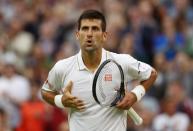 <p>Novak Djokovic of Serbia reacts following victory during the Men’s Singles second round match against Adrian Mannarino of France on day three of the Wimbledon Lawn Tennis Championships at the All England Lawn Tennis and Croquet Club on June 29, 2016 in London, England. (Photo by Julian Finney/Getty Images)</p>