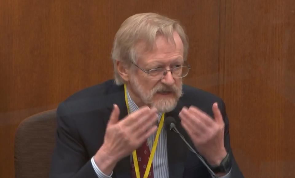 In this image from video, Dr. Martin Tobin testifies as Hennepin County Judge PeterÂ Cahill presides Thursday, April 8, 2021, in the trial of former Minneapolis police Officer Derek Chauvin at the Hennepin County Courthouse in Minneapolis, Minn.