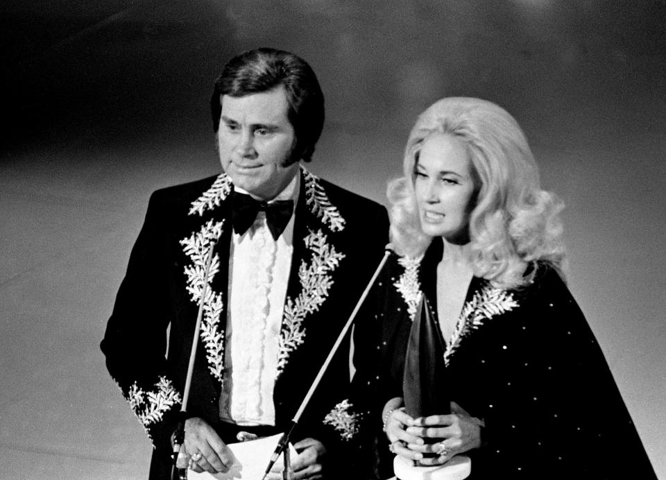 Presenters George Jones, left, and Tammy Wynette are getting ready to announce the Album of the Year winner at the 8th annual CMA Awards show Oct. 14, 1974. One of their biggest hits together is 