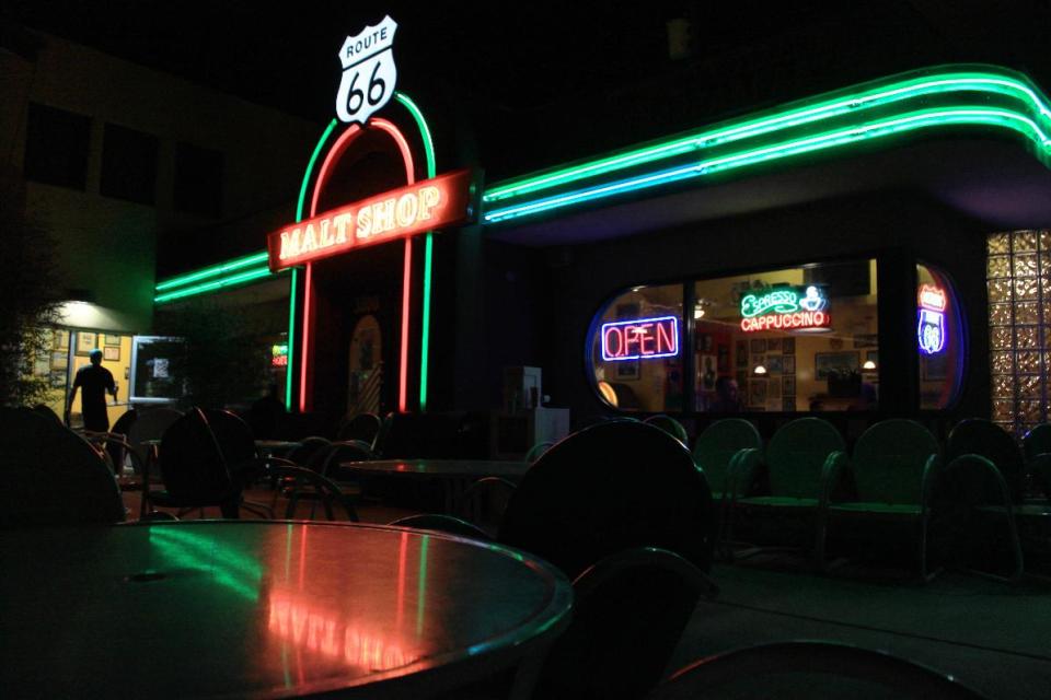 This Sept. 17, 2013 photo shows the Route 66 Malt Shop along Central Avenue in Albuquerque, N.M. A self-guided tour along this section of Route 66 offers boutiques, restaurants and a variety of neon signs, many of them vintage. (AP Photo/Susan Montoya Bryan)