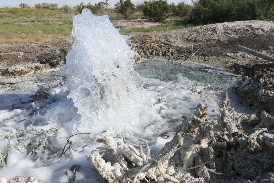 Produced water bubbles up to the surface near Imperial, Texas from an abandoned well. Produced water spills and discharges have taken a toll on lands across Texas.