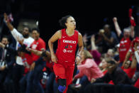 FILE - In this Oct. 10, 2019, file photo, Washington Mystics guard Kristi Toliver celebrates after her 3-point basket during the first half of Game 5 of basketball's WNBA Finals against the Connecticut Sun in Washington. Toliver is also an assistant coach with the Washington Wizards. (AP Photo/Alex Brandon, File)