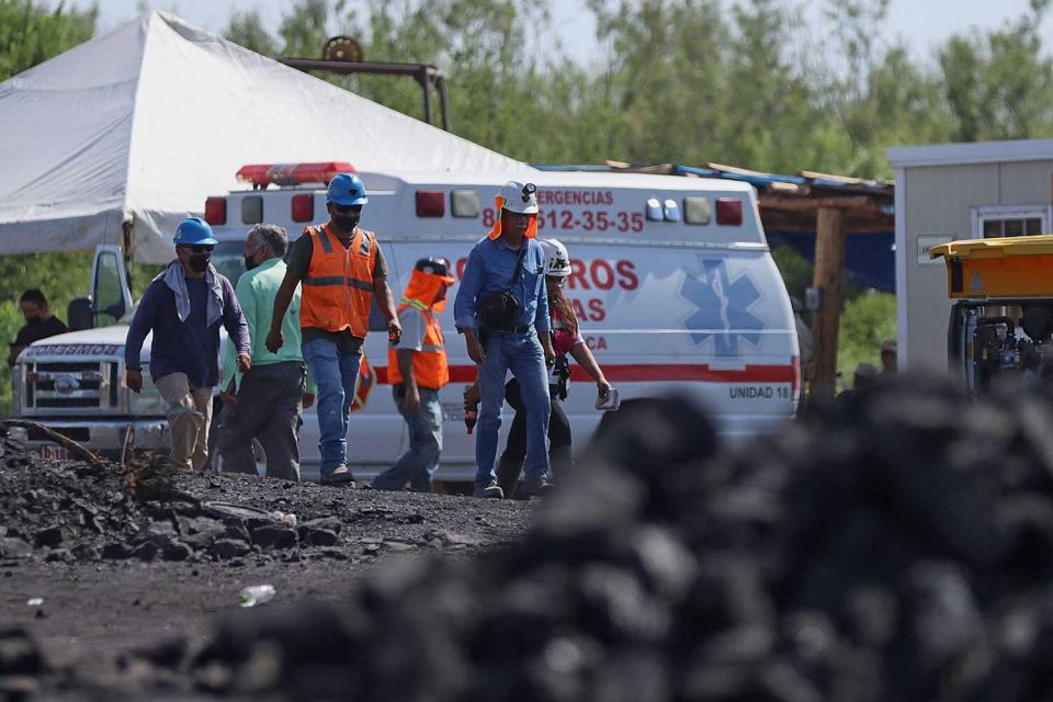 Rescue personnel work at the coal mine where 10 miners were trapped yesterday after a collapse, in the Agujita area, Sabinas municipality, Coahuila state, Mexico, on August 4, 2022. - Rescuers raced Wednesday to free about 10 workers believed to be trapped in a coal mine in northern Mexico, while three others were found alive, authorities said.