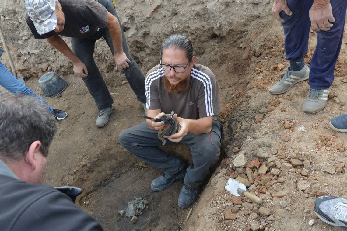 Archaeologists excavate the tintinnabulum at the ruins of Viminacium.