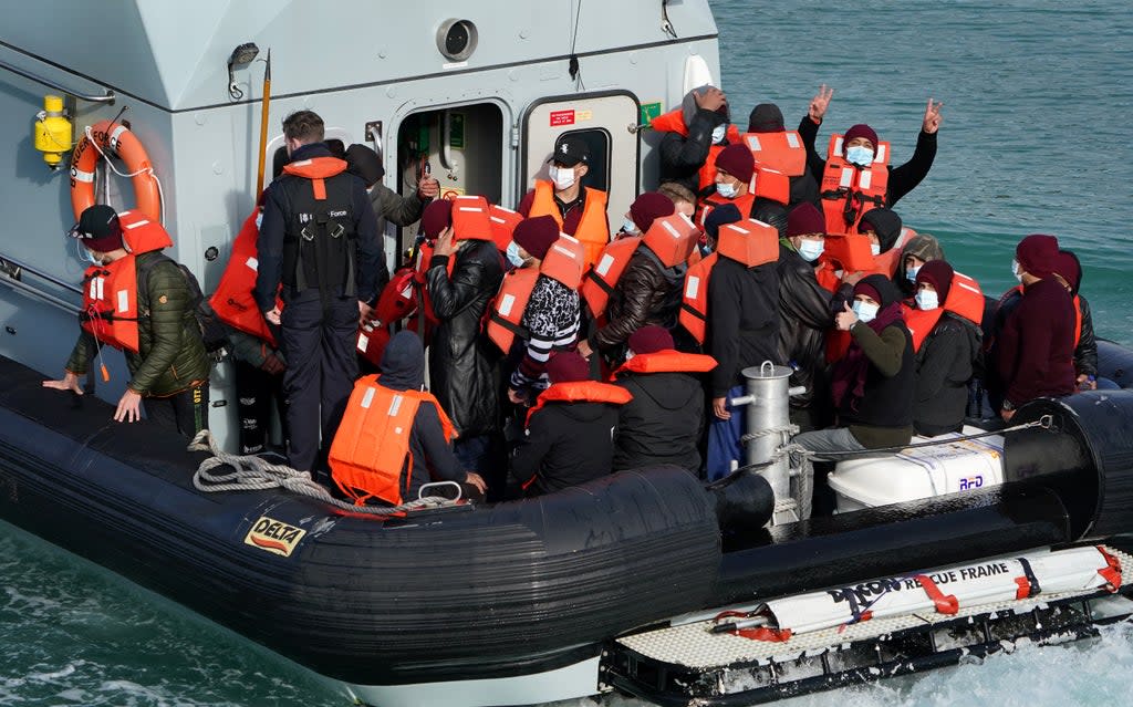 A group of people thought to be migrants are brought in to Dover by Border Force officers (Gareth Fuller/PA) (PA Wire)