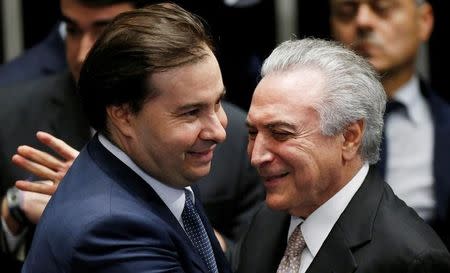 File photo: Brazil's new President Michel Temer (R) is greeted by Brazil's lower chamber Speaker Rodrigo Maia during the presidential inauguration ceremony after Brazil's Senate removed President Dilma Rousseff in Brasilia, Brazil, August 31, 2016. REUTERS/Ueslei Marcelino