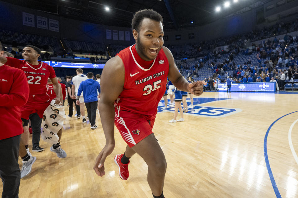 Illinois State forward Chase Walker races off the court after the team's win over Indiana State in an NCAA college basketball game Tuesday, Feb. 13, 2024, in Terre Haute, Ind. (AP Photo/Doug McSchooler)