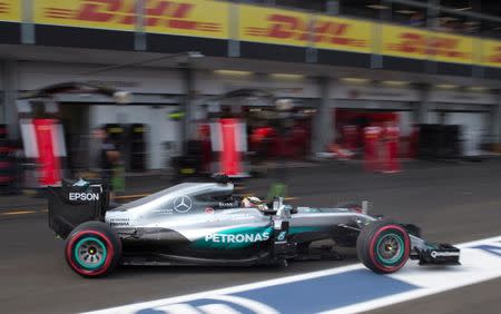 Formula One - Grand Prix of Europe - Baku, Azerbaijan - 18/6/16 - Mercedes Formula One driver Lewis Hamilton of Britain drives along the pit lane during the qualifying session. REUTERS/Valdrin Xhemaj/Pool