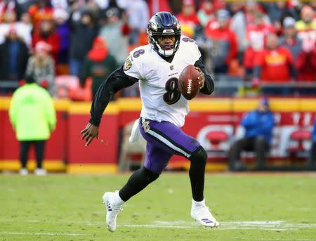 Dec 9, 2018; Kansas City, MO, USA; Baltimore Ravens quarterback Lamar Jackson (8) runs against the Kansas City Chiefs in overtime at Arrowhead Stadium. Mandatory Credit: Jay Biggerstaff-USA TODAY Sports