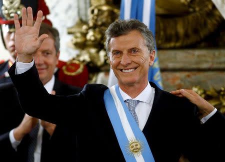 Argentina's President Mauricio Macri waves after being sworn-in as president at Casa Rosada Presidential Palace in Buenos Aires, Argentina, December 10, 2015. REUTERS/Marcos Brindicci