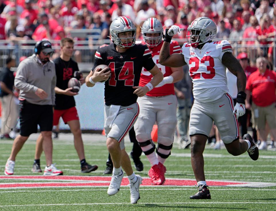 April 15, 2023; Columbus, Ohio, USA;  Defensive end Omari Abor (23) celebrates after reaching quarterback Tistan Gebbia (14) during the Ohio State spring football game Saturday at Ohio Stadium.Mandatory Credit: Barbara J. Perenic/Columbus Dispatch