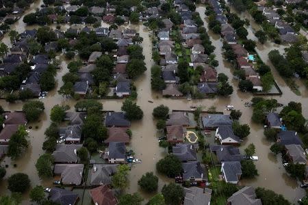 FILE PHOTO: Houses are seen submerged in flood waters caused by Tropical Storm Harvey in Northwest Houston, Texas, U.S. August 30, 2017. REUTERS/Adrees Latif/Files