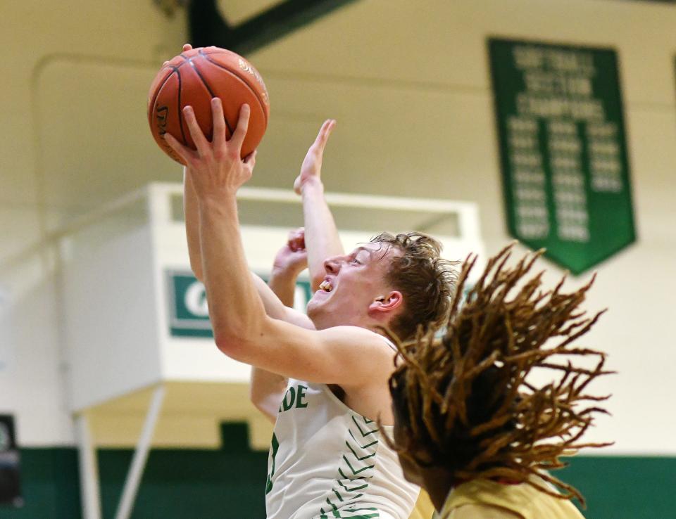 Riverside's Rob Janis shoots against New Brighton during Friday night's game at Riverside High School.