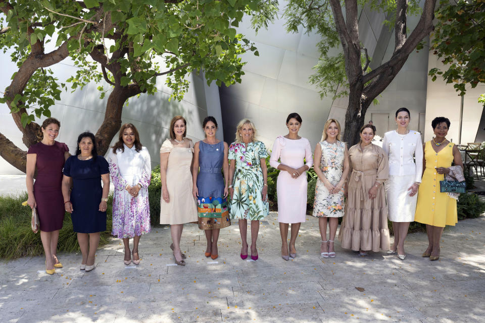 First lady Jill Biden, center, stands spouses of heads of state after the spouses luncheon at The Walt Disney Concert Hall during the Summit of the Americas, Friday, June 10, 2022, in Los Angeles. (AP Photo/Michael Owen Baker)