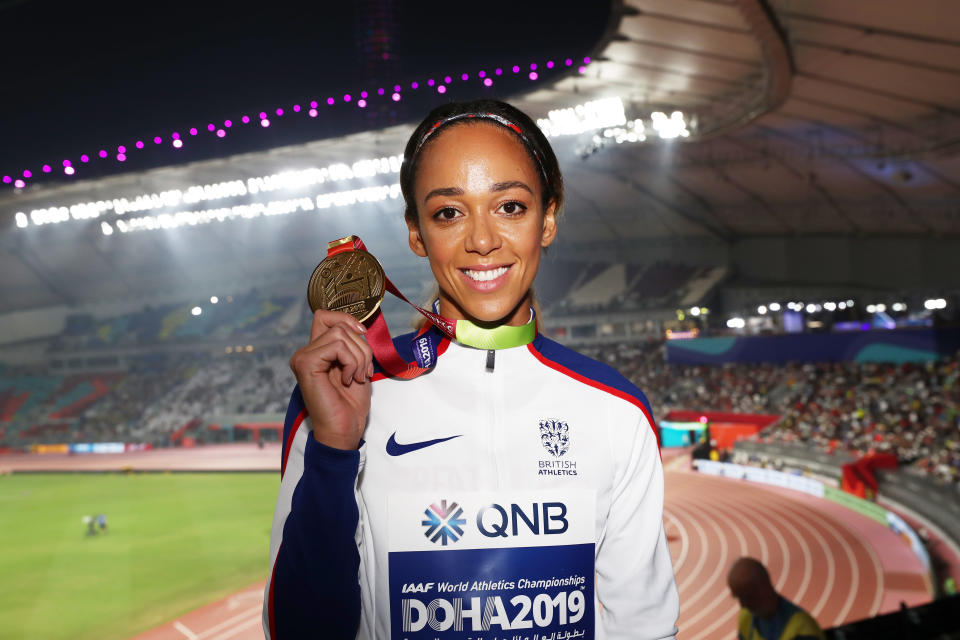 DOHA, QATAR - OCTOBER 04: Gold medalist Katarina Johnson-Thompson of Great Britain stands on the podium during the medal ceremony for the Women's Heptathlon during day eight of 17th IAAF World Athletics Championships Doha 2019 at Khalifa International Stadium on October 04, 2019 in Doha, Qatar. (Photo by Maja Hitij/Getty Images)