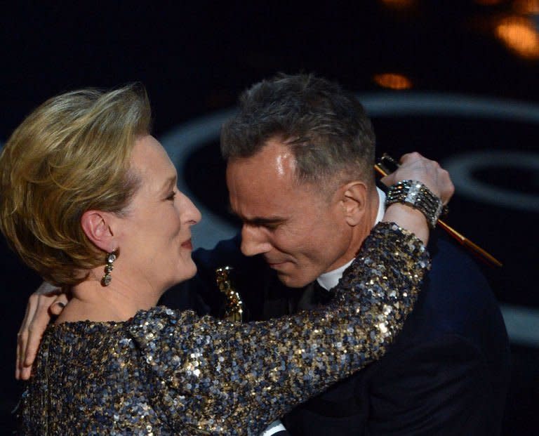 Actress Meryl Streep presents the trophy for Best Actor to Daniel Day-Lewis onstage at the 85th Annual Academy Awards on February 24, 2013 in Hollywood, California. Ben Affleck's Iran hostage drama "Argo" won the coveted best film Oscar late Sunday, while Daniel Day-Lewis took a record third best actor prize at the 85th Academy Awards, Hollywood's biggest night