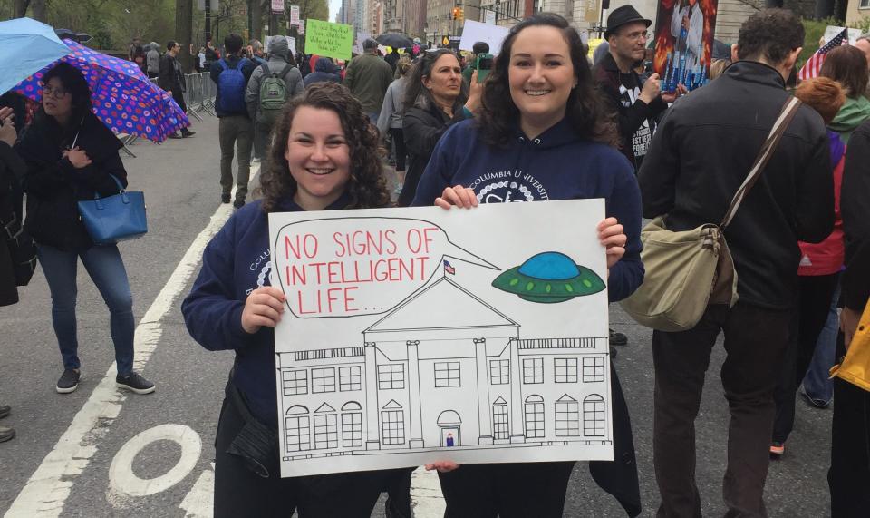 Demonstrator Rachel Misner (right) shows off her sign with friend, Sarah.&nbsp;