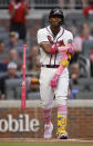 Atlanta Braves' Ronald Acuna Jr. flips his bat after walking on pitches from Philadelphia Phillies' Aaron Nola during the first inning of a baseball game Sunday, May 9, 2021, in Atlanta. (AP Photo/Ben Margot)