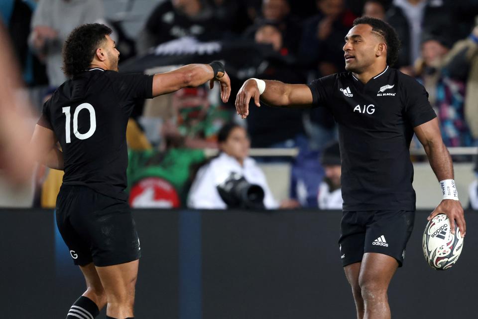 New Zealand's Sevu Reece (pictured right) celebrates a try with a teammate Richie Mounga (pictured left) during the second match of Bledisloe Cup.