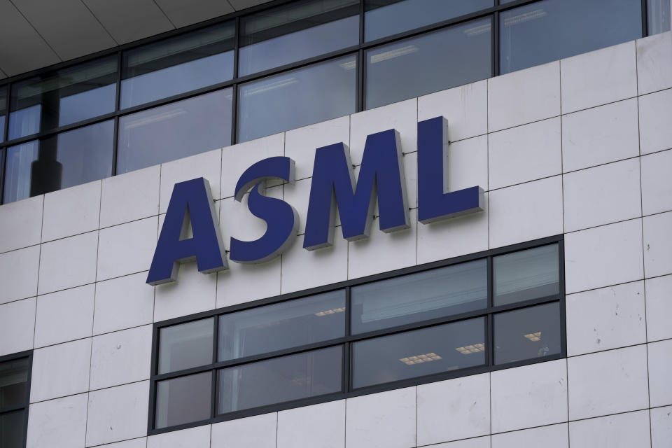FILE - the logo of ASML, a leading maker of semiconductor production equipment, hangs on the head office in Veldhoven, Netherlands, Monday, Jan. 30, 2023. China’s foreign minister appealed Tuesday, Jan. 31, 2023, to his Dutch counterpart to defend free trade after the Netherlands and Japan agreed to cooperate with U.S. restrictions on Chinese access to advanced processor chip technology due to security concerns. (AP Photo/Peter Dejong, File)