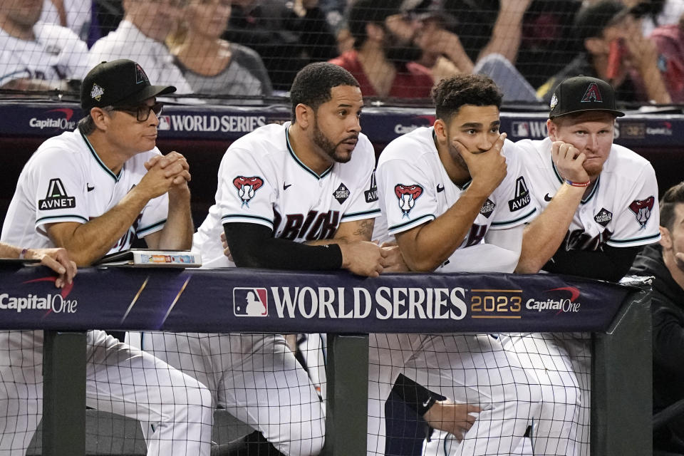 Members of the Arizona Diamondbacks watch during the ninth inning in Game 5 of the baseball World Series against the Texas Rangers Wednesday, Nov. 1, 2023, in Phoenix. (AP Photo/Brynn Anderson)