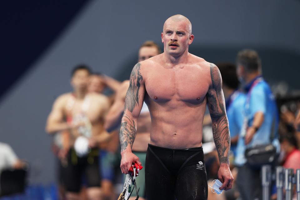 Adam Peaty walks away after winning his heat (Getty Images)