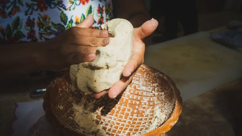 Hands making masa