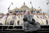 <p>Members of the Mormon Tabernacle Choir sit in the rain waiting for the swearing in of Donald Trump as the 45th president of the United States to begin during the 58th Presidential Inauguration at the U.S. Capitol in Washington. Friday, Jan. 20, 2017. (Photo: Carolyn Kaster/AP) </p>