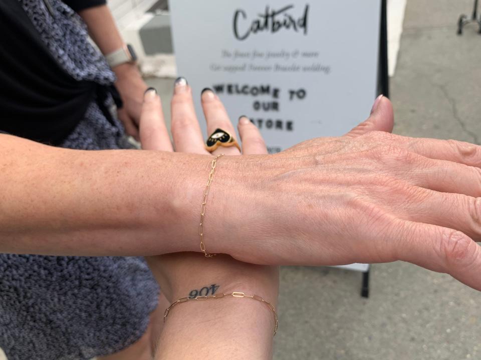 The author and her mom show off their gold bracelets.