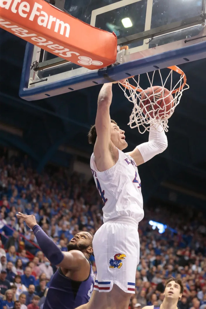 Kansas super-senior forward Mitch Lightfoot (44) dunks over TCU during the first half of Thursday's game inside Allen Fieldhouse.