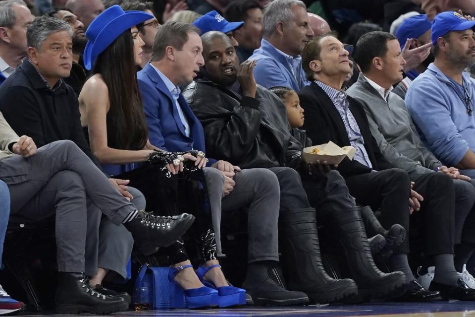 Kanye West talks with Golden State Warriors owner Joe Lacob during the Golden State Warriors vs. Boston Celtics basketball game in San Francisco on March 16, 2022. - Credit: AP/Jeff Chiu