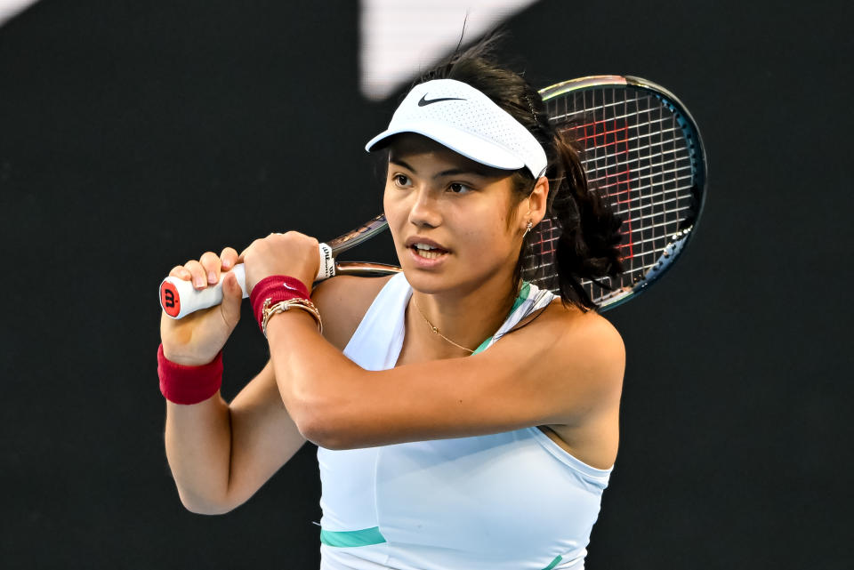 Emma Raducanu of Great Britain hits a backhand against Danka Kovinic of Montenegro at the Australian Open.