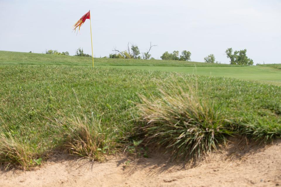 A sand trap near the 17th hole at Mayetta's Firekeeper Golf Course holds on to native grasses while still offering golfers a traditional obstacle to avoid on their approach to the green.