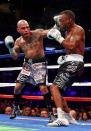 NEW YORK, NY - DECEMBER 01: Miguel Cotto (L) connects on a punch while fighting against Austin Trout in their WBA Super Welterweight Championship title fight at Madison Square Garden on December 1, 2012 in New York City. (Photo by Elsa/Getty Images)