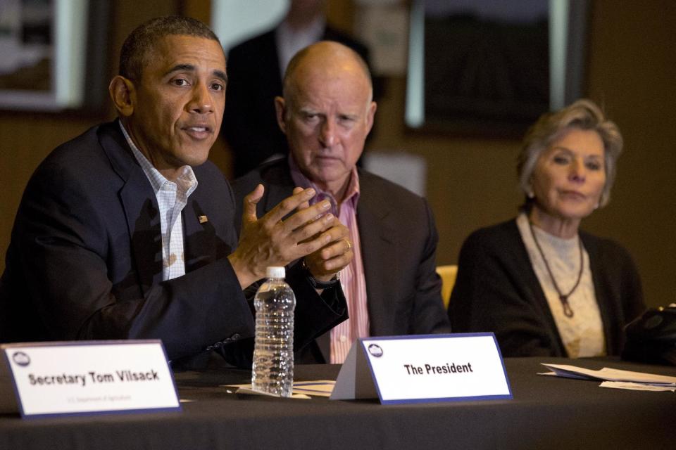 President Barack Obama, left, speaks during a roundtable with community leaders including California Gov. Jerry Brown, and Sen. Barbara Boxer, D-Calif., at San Luis Water Facility in Firebaugh, Calif., Friday, Feb. 14, 2014, regarding the ongoing drought. (AP Photo/Jacquelyn Martin)