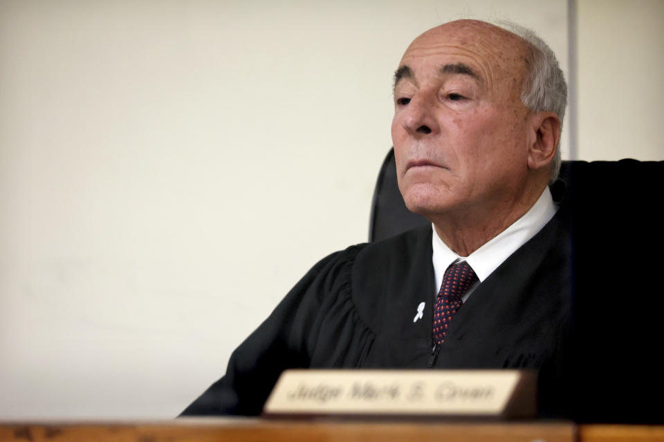 Judge Mark S. Coven presides over the arraignment of Brian Walshe, Wednesday, Jan. 18, 2023, at Quincy District Court, in Quincy, Mass., on a charge of murdering his wife Ana Walshe. Not guilty pleas were entered on behalf of Walshe, 47. Ana Walshe was reported missing Jan. 4, 2023 by her employer in Washington, where the couple has a home. (Craig F. Walker/The Boston Globe via AP, Pool)