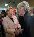 Parti Quebecois leader Pauline Marois shakes the hand of a supporter during a campaign stop in Quebec City, April 6, 2014. Quebec voters will head to the poll in a provincial election on April 7. REUTERS/Mathieu Belanger (CANADA - Tags: POLITICS ELECTIONS)