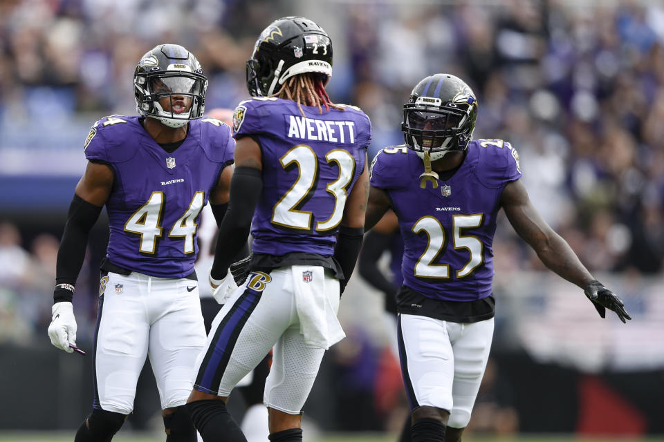 Baltimore Ravens cornerback Marlon Humphrey (44), cornerback Anthony Averett (23) and cornerback Tavon Young (25) react after stopping the Cincinnati Bengals on a third down play during the first half of an NFL football game, Sunday, Oct. 24, 2021, in Baltimore. (AP Photo/Gail Burton)