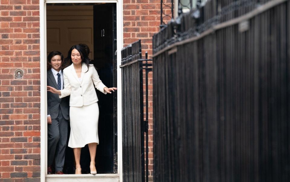 Lucia Guo, Jeremy Hunt's wife, and their son Jack leave Downing Street to watch him deliver his Budget in the Commons