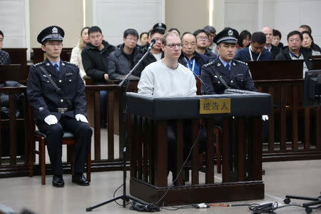 Canadian Robert Lloyd Schellenberg appears in court for a retrial of his drug smuggling case in Dalian, Liaoning province, China, January 14, 2019, in this handout picture received by Reuters January 15, 2019. Intermediate People's Court of Dalian/Handout via REUTERS