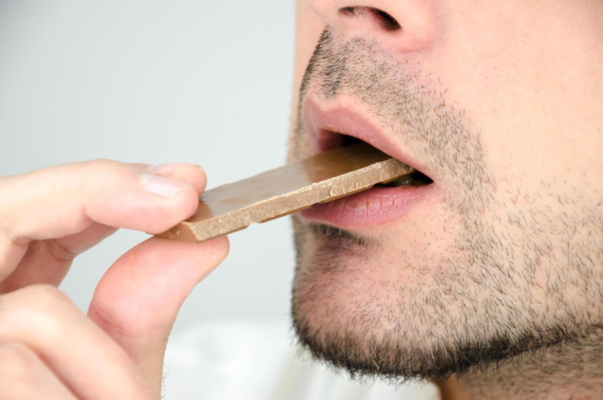 man eating chocolate