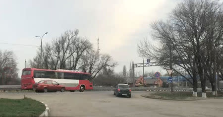 A still image from a video footage taken on April 17, 2018 shows a bus transferring Russian private military contractors on a highway near Rostov-on-Don on its way to the Defence Ministry base in Molkino, Russia. REUTERS/Stringer