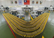 Taiwan's Indigenous Defense Fighter (IDF) jets are displayed with their weapons payload during a visit by Taiwan President Tsai Ing-wen at the Penghu Magong military air base in outlying Penghu Island, Taiwan Tuesday, Sept. 22, 2020. Tsai visited the military base on one of Taiwan’s outlying islands Tuesday in a display of resolve following a recent show of force by rival China. (AP Photo/Johnson Lai)