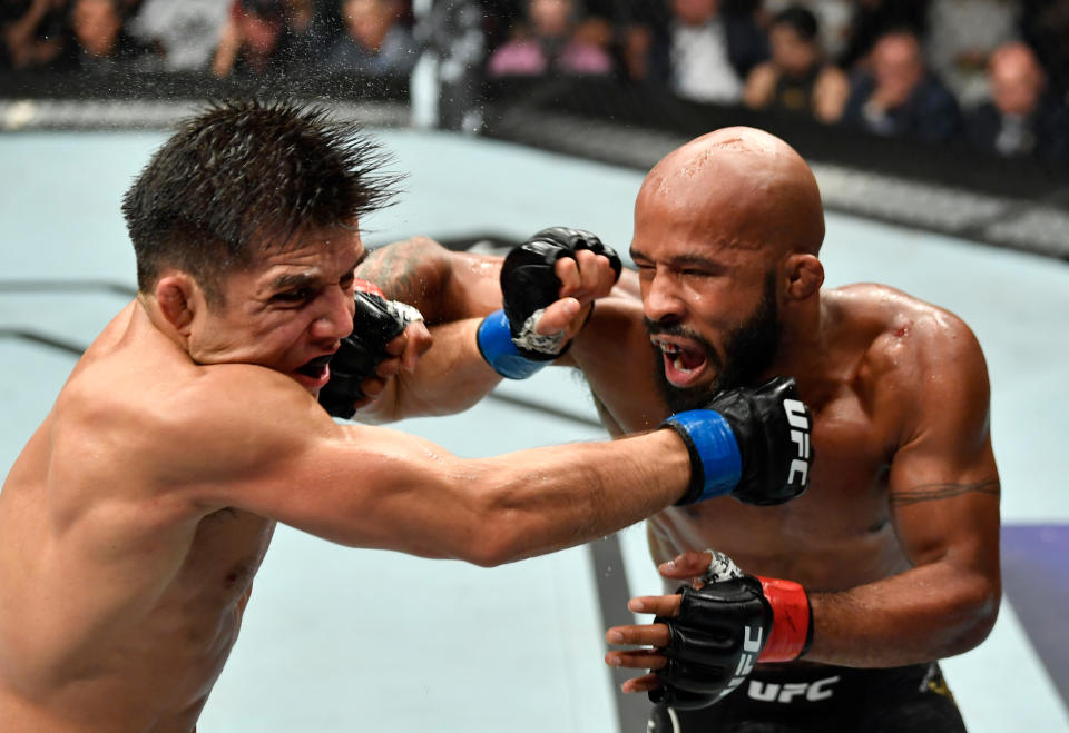 LOS ANGELES, CA - AUGUST 04:  (R-L) Demetrious Johnson punches Henry Cejudo in their UFC flyweight championship fight during the UFC 227 event inside Staples Center on August 4, 2018 in Los Angeles, California. (Photo by Jeff Bottari/Zuffa LLC/Zuffa LLC via Getty Images)